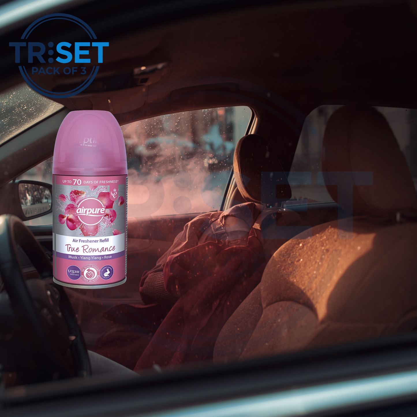 Car interior with a pink air freshener bottle labeled 'True Romance' and 'TRISET' branding.